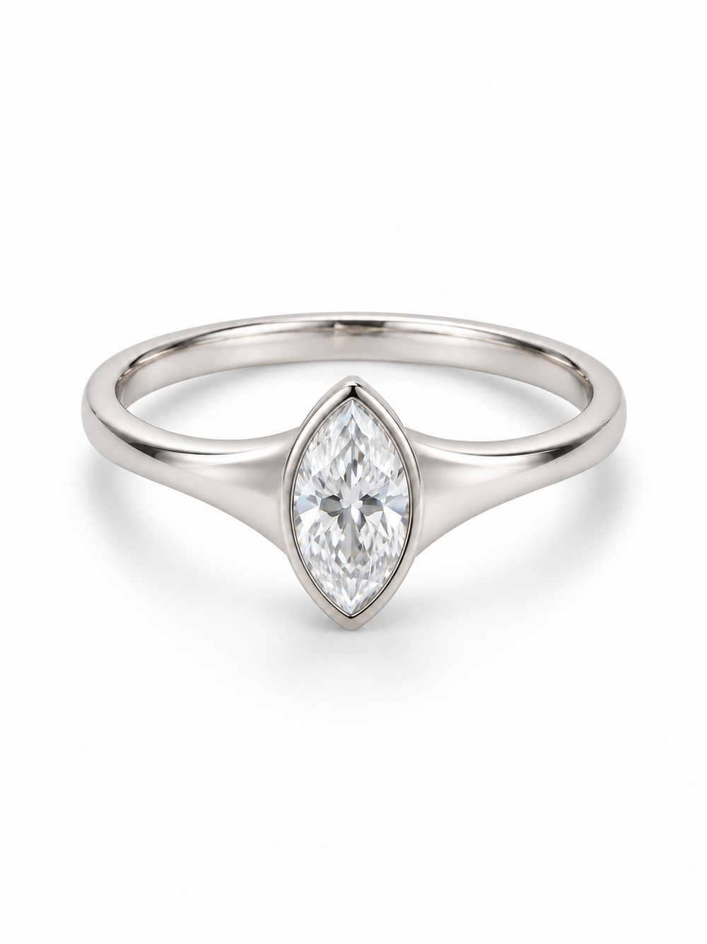 White gold ring with solid tapered shoulders and a bezel-set marquise moissanite