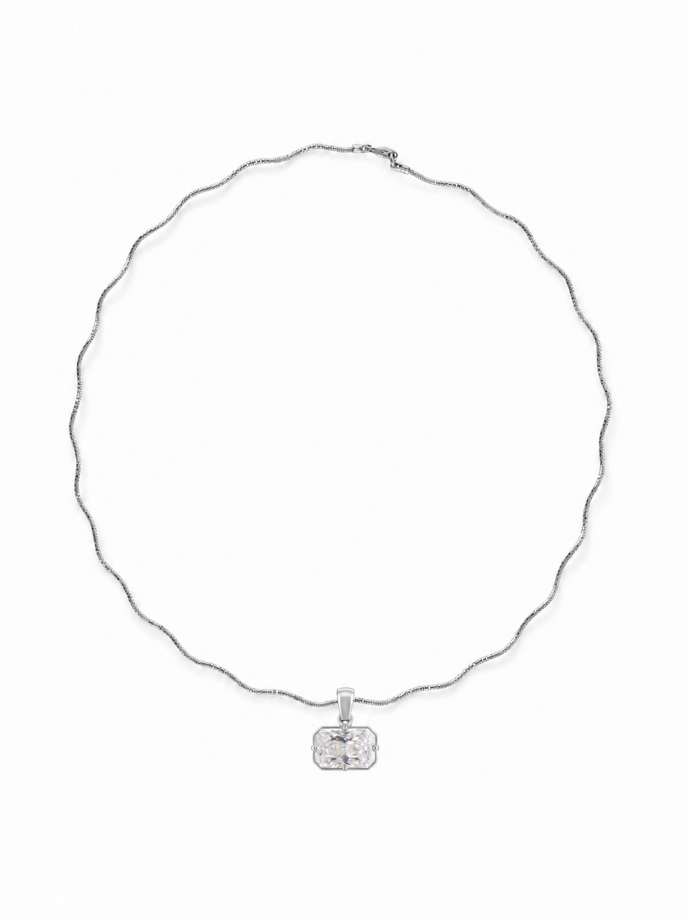 Miro east-west radiant-cut pendant on a white-gold Solene sculptural necklace, shown on white.