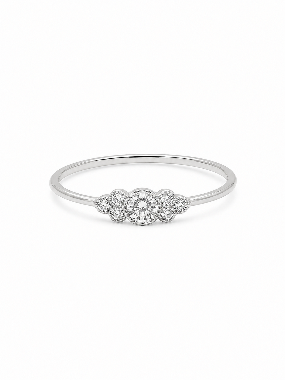 Noa round cluster ring in white gold with a clear circular center stone and six round side stones