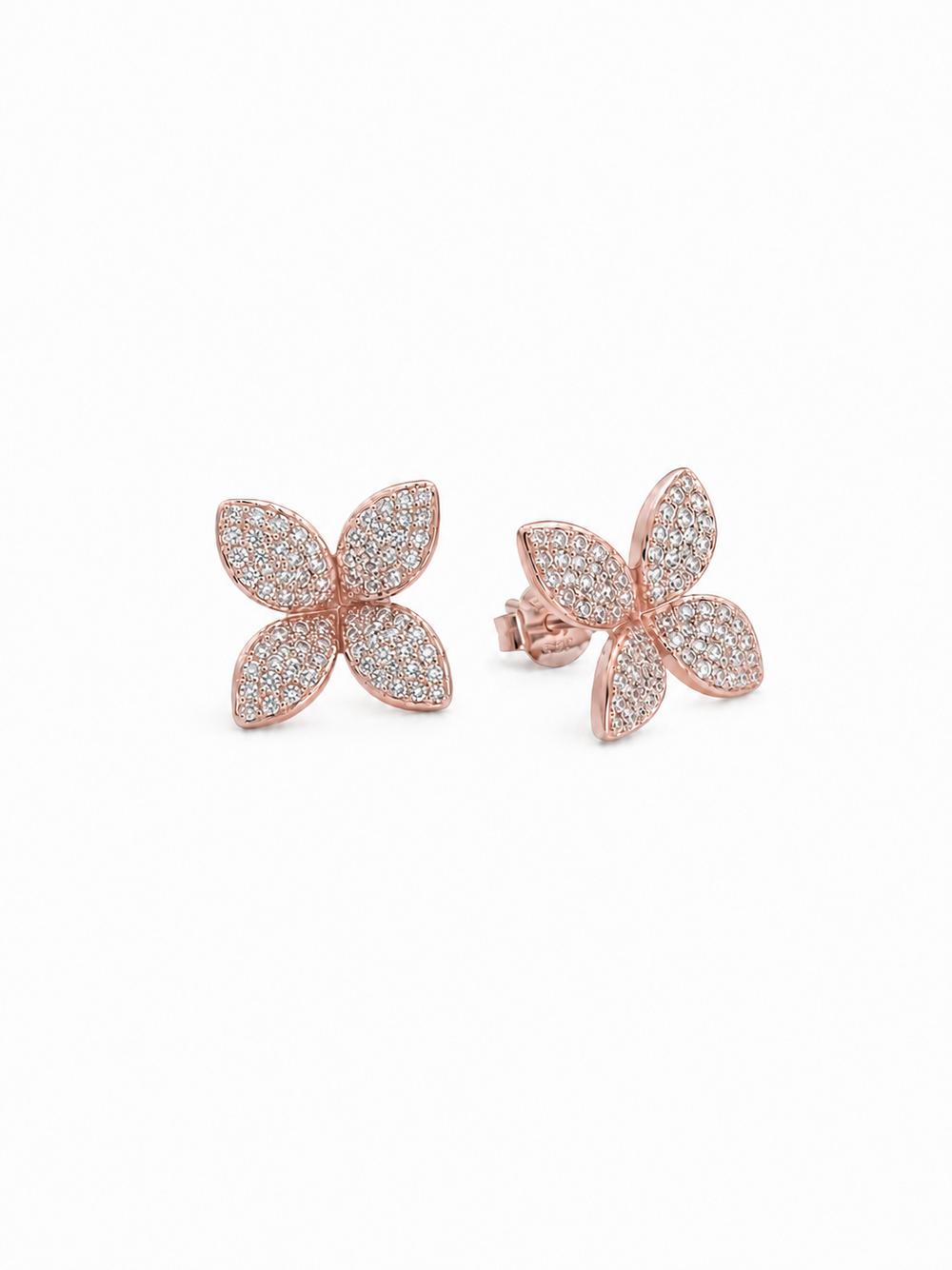 Ecommerce product view of the 3D Four-Petal Pavé Stud Earrings in 18K rose gold vermeil, showing the pair's lifted marquise-shaped petals, dense white pavé stones, soft blush-gold rims, posts, and butterfly backs on a pure white background.