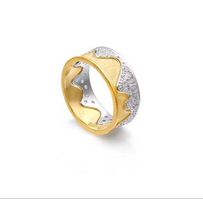 Gold and silver ring on a white background