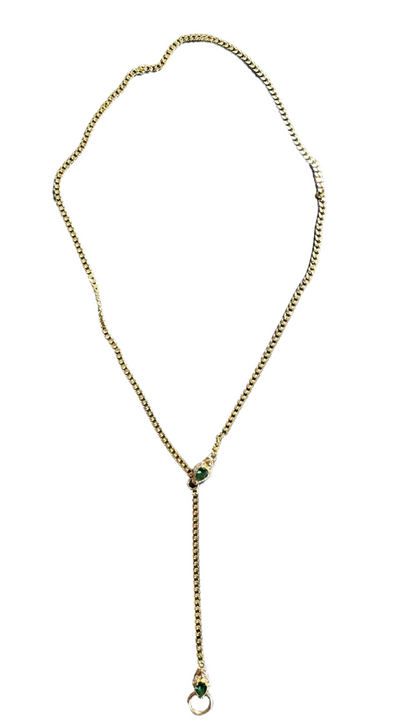 ￼Image of lariat Cuban chain with green accent in yellow gold finish on white background. 
