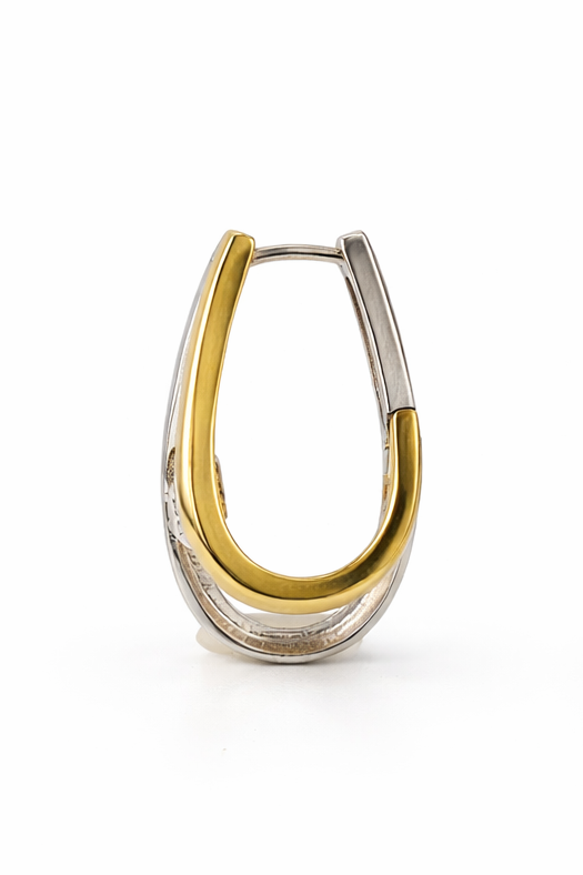 Two tone, yellow and white gold hoop earring on white background.