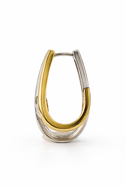 Two tone, yellow and white gold hoop earring on white background.