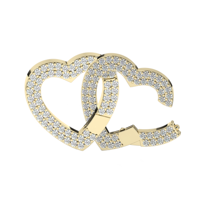 Close-up view of two interlocked gold heart charms encrusted with sparkling stones. The design features overlapping hearts that create a luxurious, radiant look, perfect for a bracelet or necklace charm.