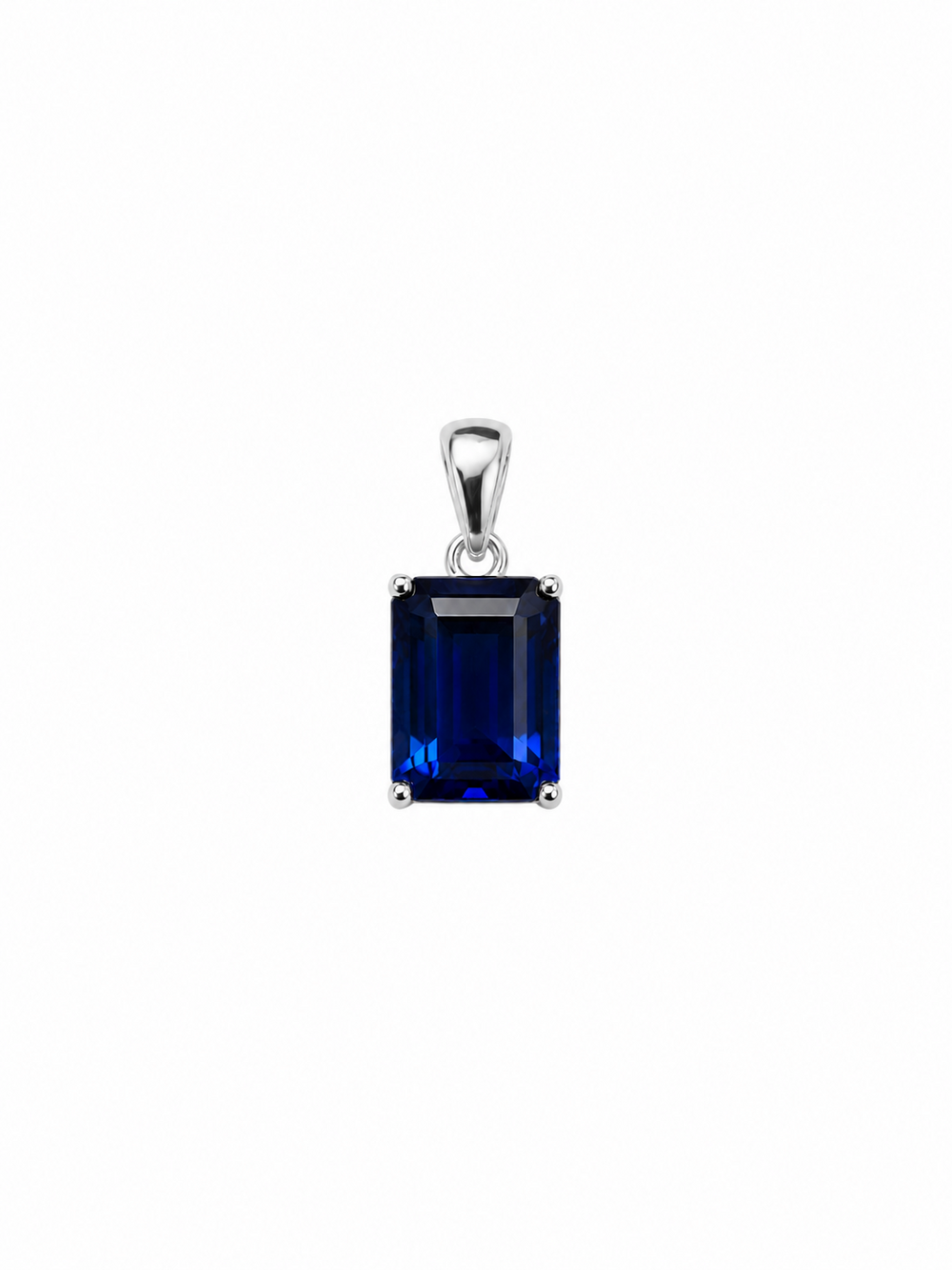 Azra sapphire-blue pendant with white-gold bail and four-prong setting, shown on white.