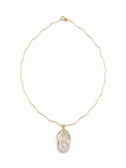 Irregular freshwater baroque pearl pendant on the yellow-gold Free-Willed Sculptural Necklace, shown on white.