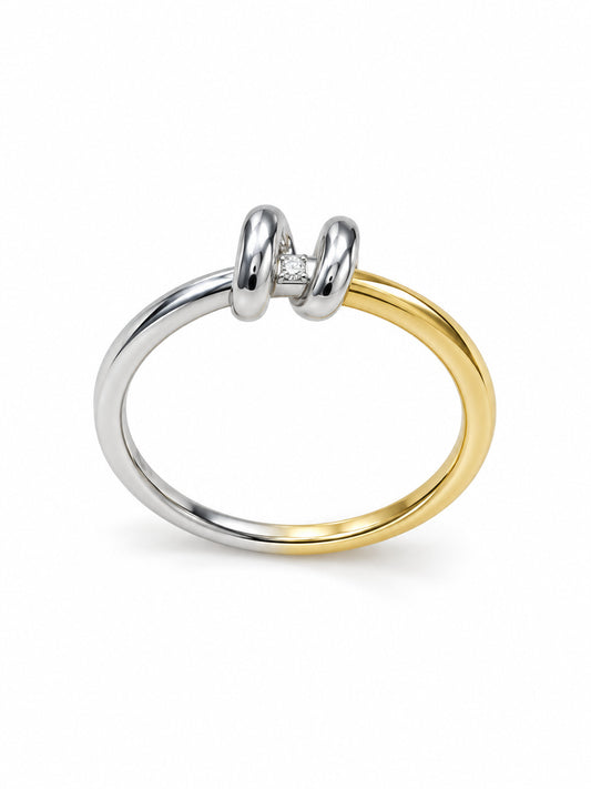 Double Take Duo Ring with overlapping yellow- and white-tone bands, paired sculptural loops and one clear stone
