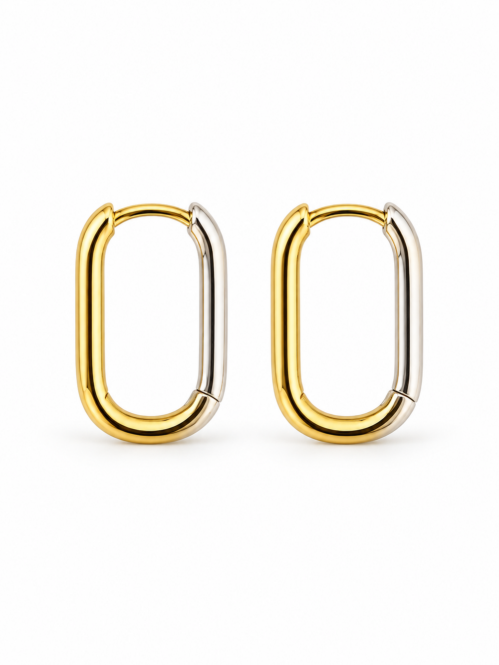 Pair of elongated reversible Link Huggie Hoop earrings in polished yellow gold and white rhodium, shown closed on a white background