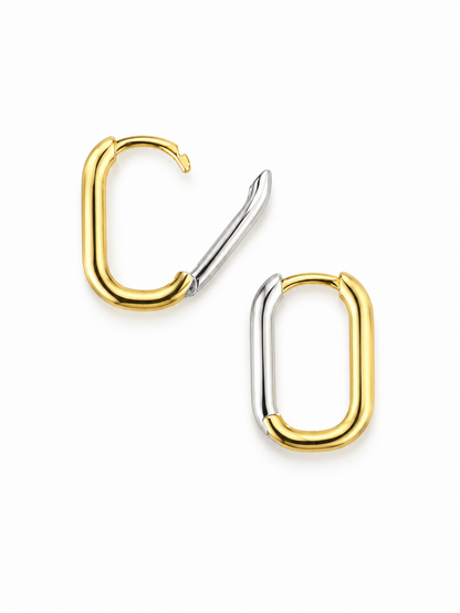 Double-tone Link Huggie Hoop earrings in yellow gold and white rhodium, with one hinged clasp open to show the reversible construction