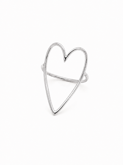 Freehand heart statement ring in polished white gold, front three-quarter product view on white.