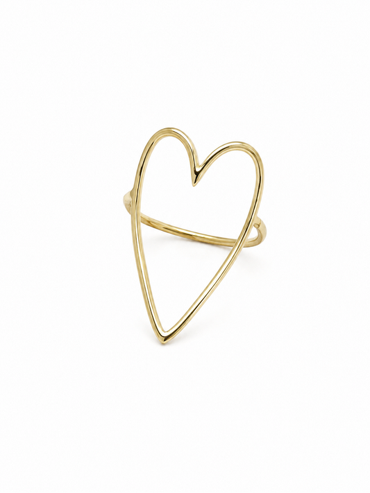 Freehand heart statement ring in polished yellow gold, front three-quarter product view on white.