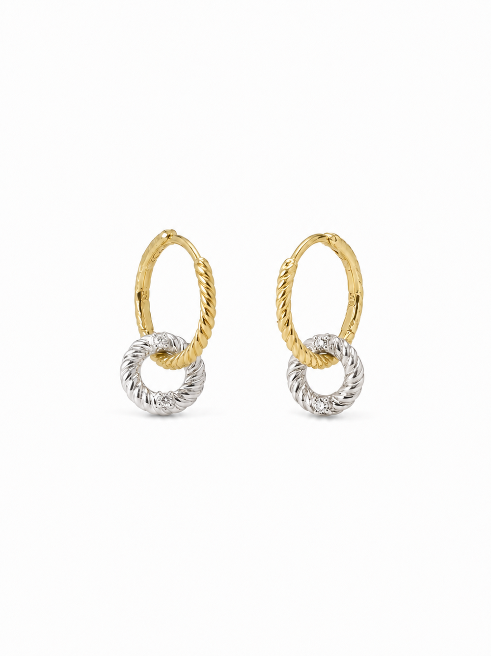 Pair of interlocking loop earrings with yellow-gold twisted upper huggies and smaller white-gold rope-textured drop loops, photographed on a pure white background.