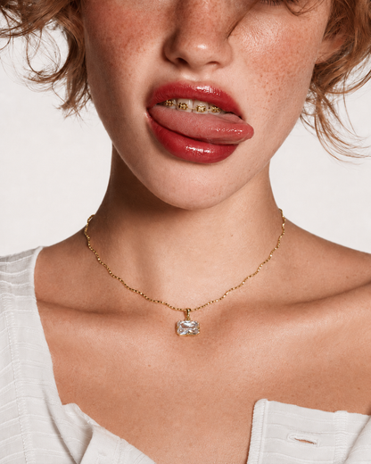 Model wearing the Miro east-west radiant Solene sculptural necklace.