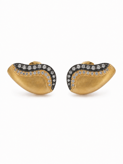 Pair of matte yellow-gold ear-grill studs with a black-rhodium outer stone wave and gold inner pavé wave
