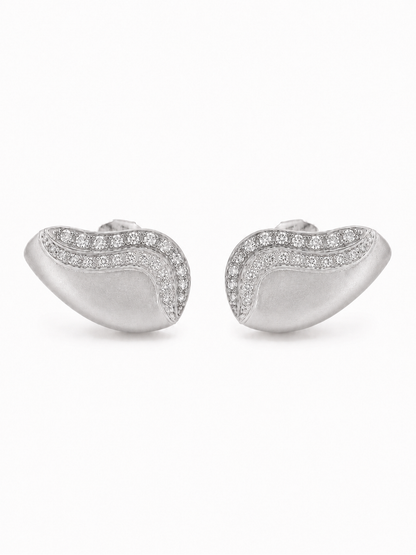 Pair of matte white-gold ear-grill studs with two nested clear-stone waves