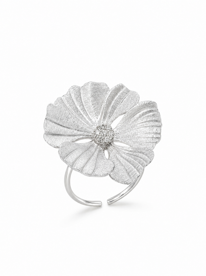 Ecommerce product view of the No Wallflower adjustable peony cocktail ring in 18K white gold vermeil, showing its matte textured sculptural petals, white pavé center, and slender adjustable band on a pure white background.