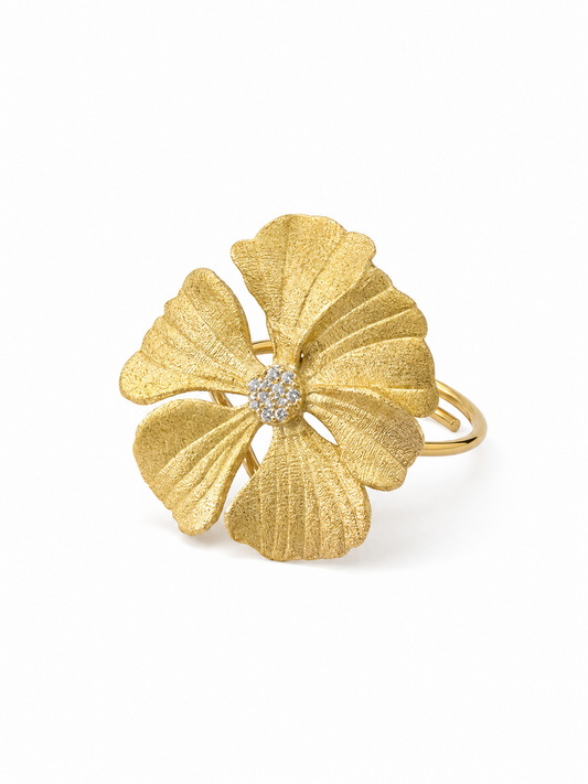 Ecommerce product view of the No Wallflower adjustable peony cocktail ring in 18K yellow gold vermeil, showing its matte textured sculptural petals, white pavé center, and slender adjustable band on a pure white background.