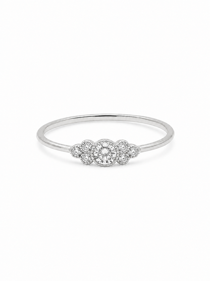 Noa round cluster ring in white gold with a clear circular center stone and six round side stones