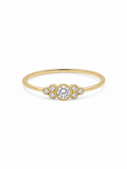 Noa round cluster ring in yellow gold with a clear circular center stone and six round side stones