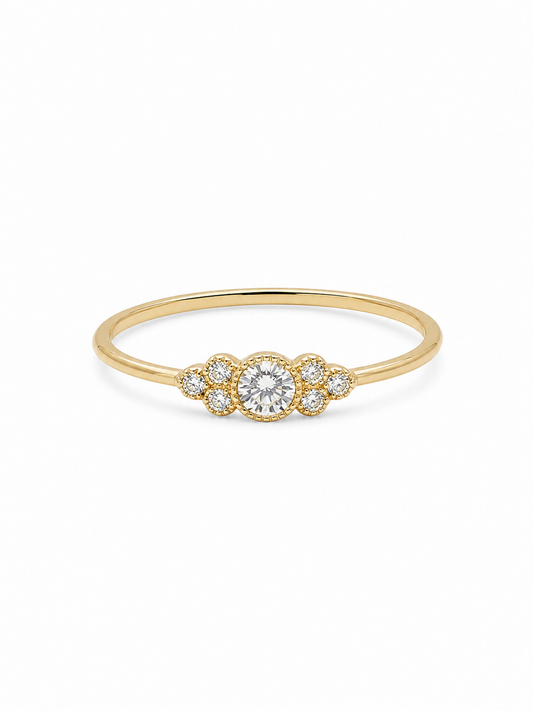 Noa round cluster ring in yellow gold with a clear circular center stone and six round side stones