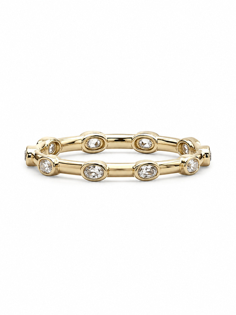 Yellow gold Orbit Bezel 360 stacker ring shown horizontally