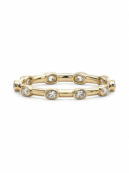 Yellow gold Orbit Bezel 360 stacker ring shown horizontally