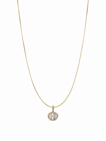 Petite single-stone yellow-gold bezel pendant on a fine 0.65 mm side snake chain, photographed on white.