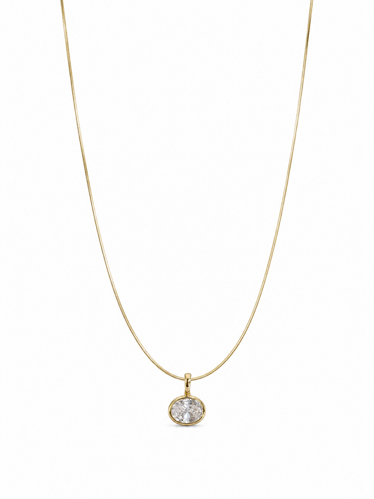 Petite single-stone yellow-gold bezel pendant on a fine 0.65 mm side snake chain, photographed on white.