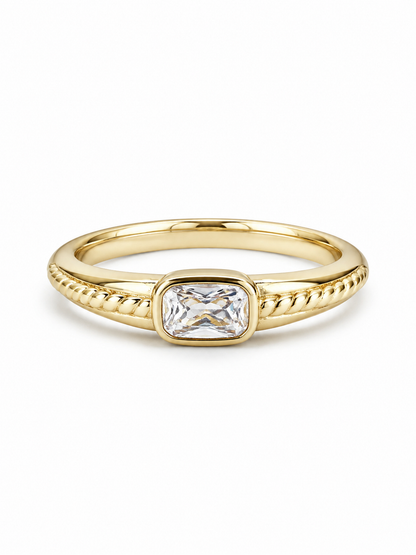 Yellow gold east-west clear rectangular bezel ring with rope-textured shoulders