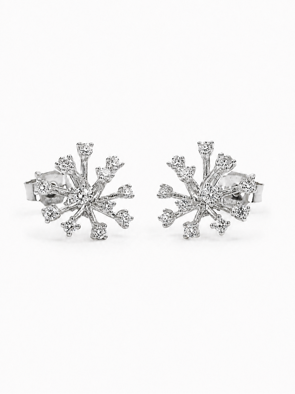 Pair of white-gold organic starburst stud earrings with clear stones at the center and branch tips