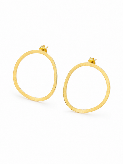 Ecommerce product view of the Seen, Not Felt statement stud earrings in 18K yellow gold vermeil, showing their lightweight softly irregular open outlines, fine brushed finish, slender flat construction, posts, and butterfly backs on a pure white background.