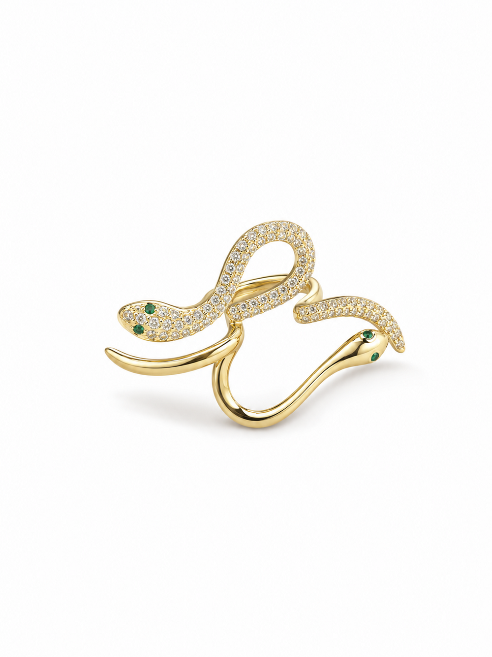 Adjustable double-serpent wrap ring in yellow gold with one clear pavé serpent, one polished serpent and small green eye details on white.