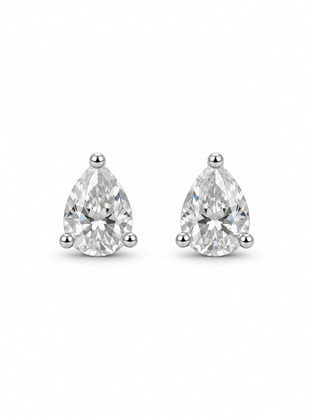 Pair of clear pear three-prong stud earrings in polished white-gold color on a white background