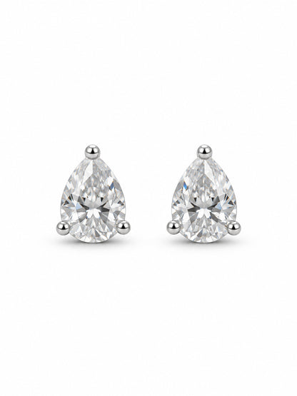 Pair of clear pear three-prong stud earrings in polished white-gold color on a white background