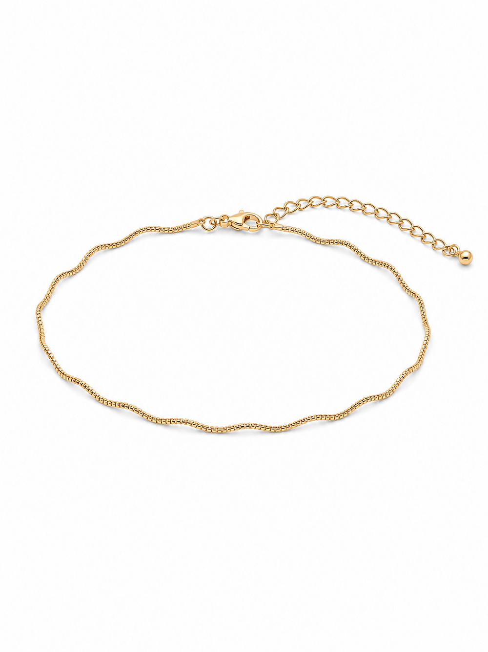 Solene wavy bracelet in yellow gold, arranged as a compact wrist-sized oval with its lobster clasp and full 2-inch extension chain visible on a white background.