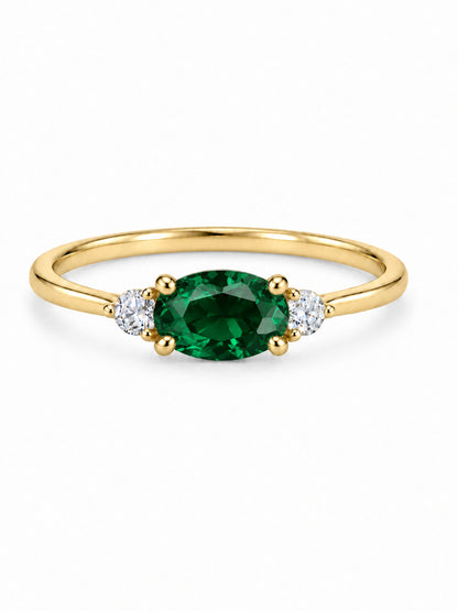 Three Wishes Oval Ring in yellow gold tone with an emerald-green oval center stone and two round clear side stones