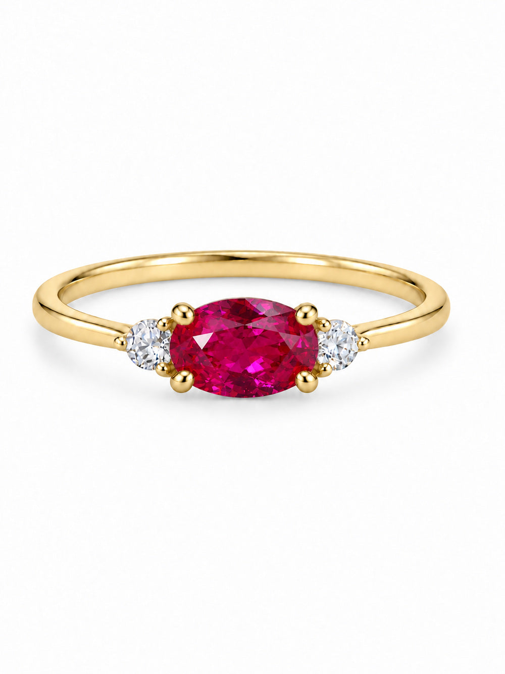Three Wishes Oval Ring in yellow gold tone with a ruby-red oval center stone and two round clear side stones